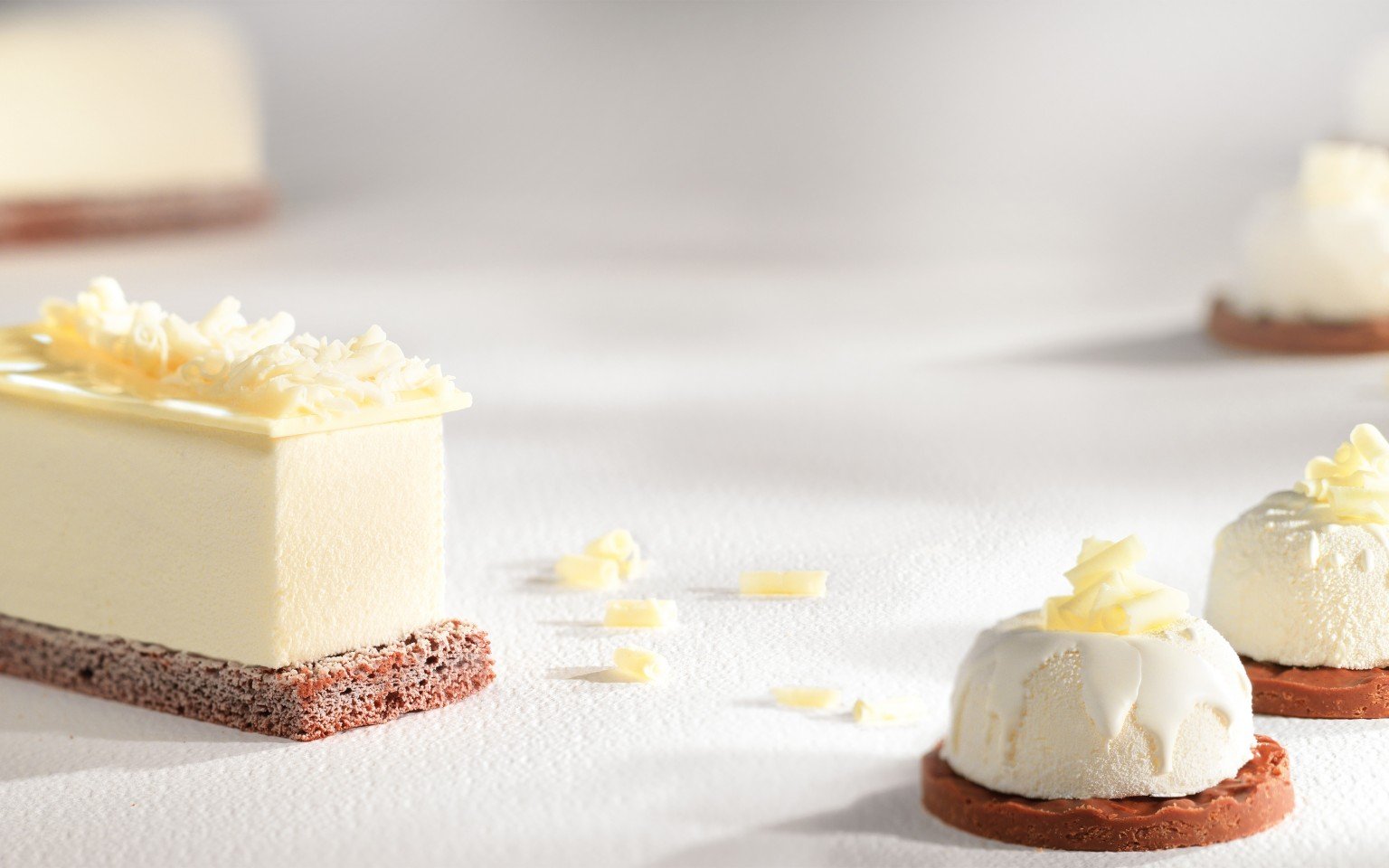 Callebaut Mona Lisa White Chocolate Blossom Curls Callebaut Chocolate Topping - Bake Supply Plus