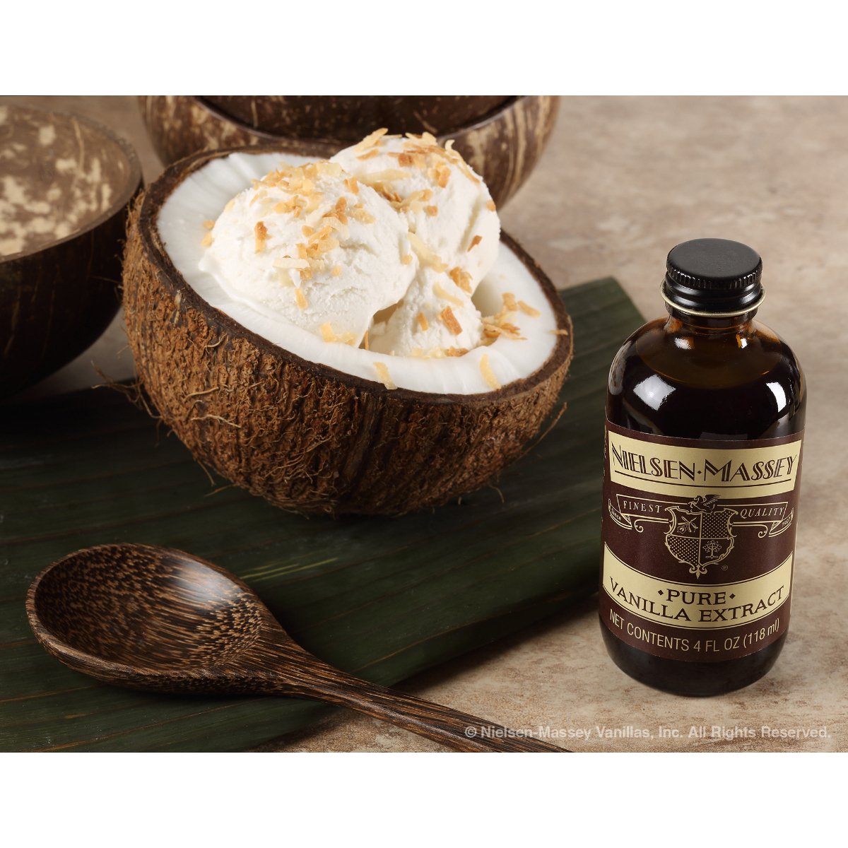 Nielsen-Massey Pure Vanilla Extract in an 8 oz glass bottle, showcasing clear vanilla extract for baking and cooking.