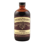 Nielsen-Massey pure vanilla extract in a clear glass bottle with a black cap, showing golden vanilla extract inside.
